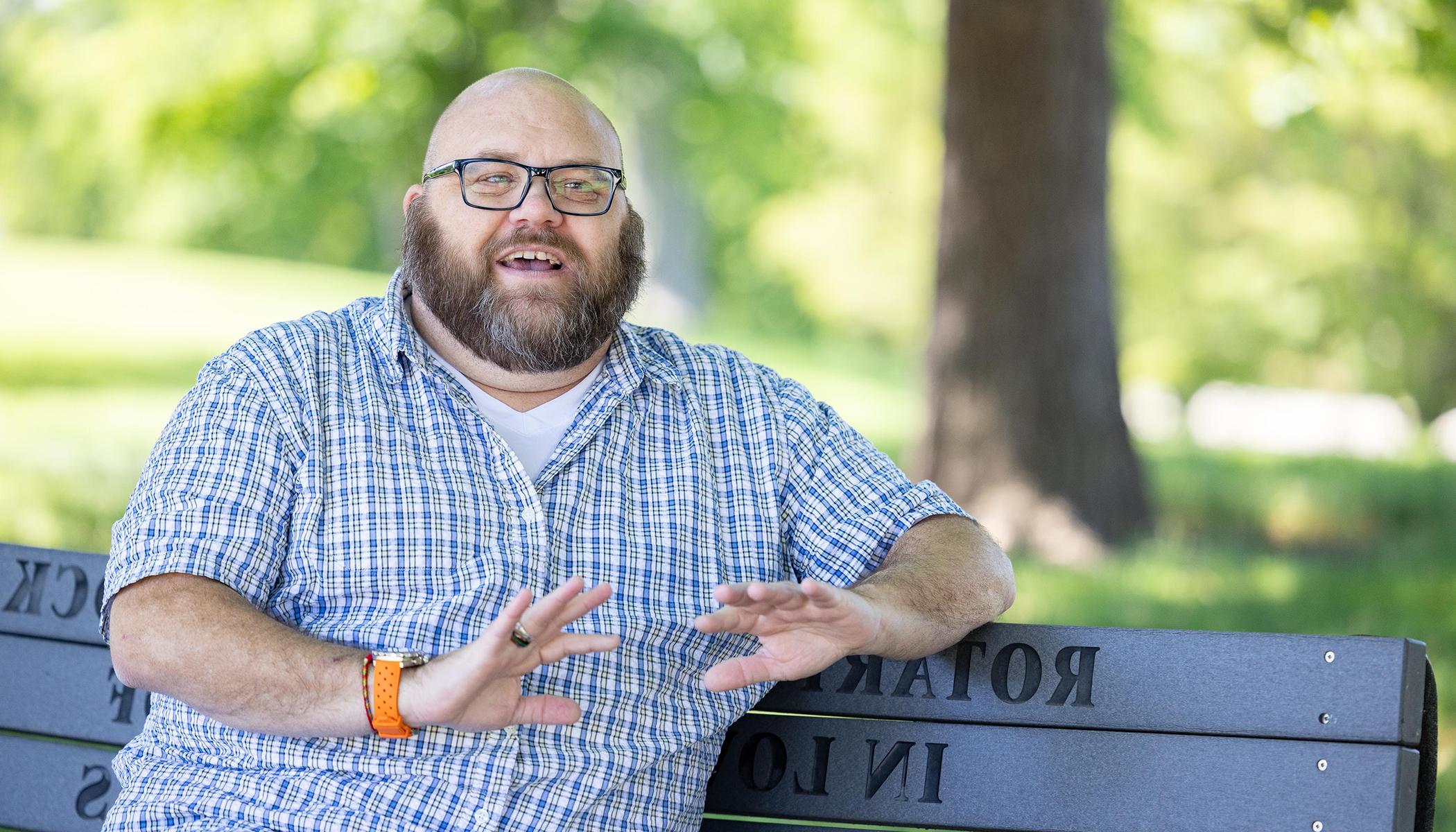 Jonathan Springborn sitting on a park bench.